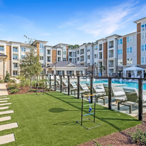 Lush Landscaping Bainbridge Cary game lawn and walkway to the clubhouse